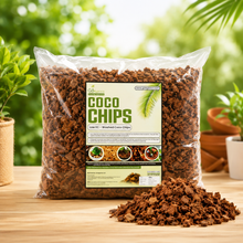 ag of Coco Chips (washed coco coir) sits on a wooden table with a pile of the brown coir chips in front. The background is a soft-focus green garden with potted plants.
