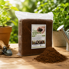 A bag of Coco Peat World Organic Coir Substrate placed on a wooden table with a small pile of the brown peat material in front. 